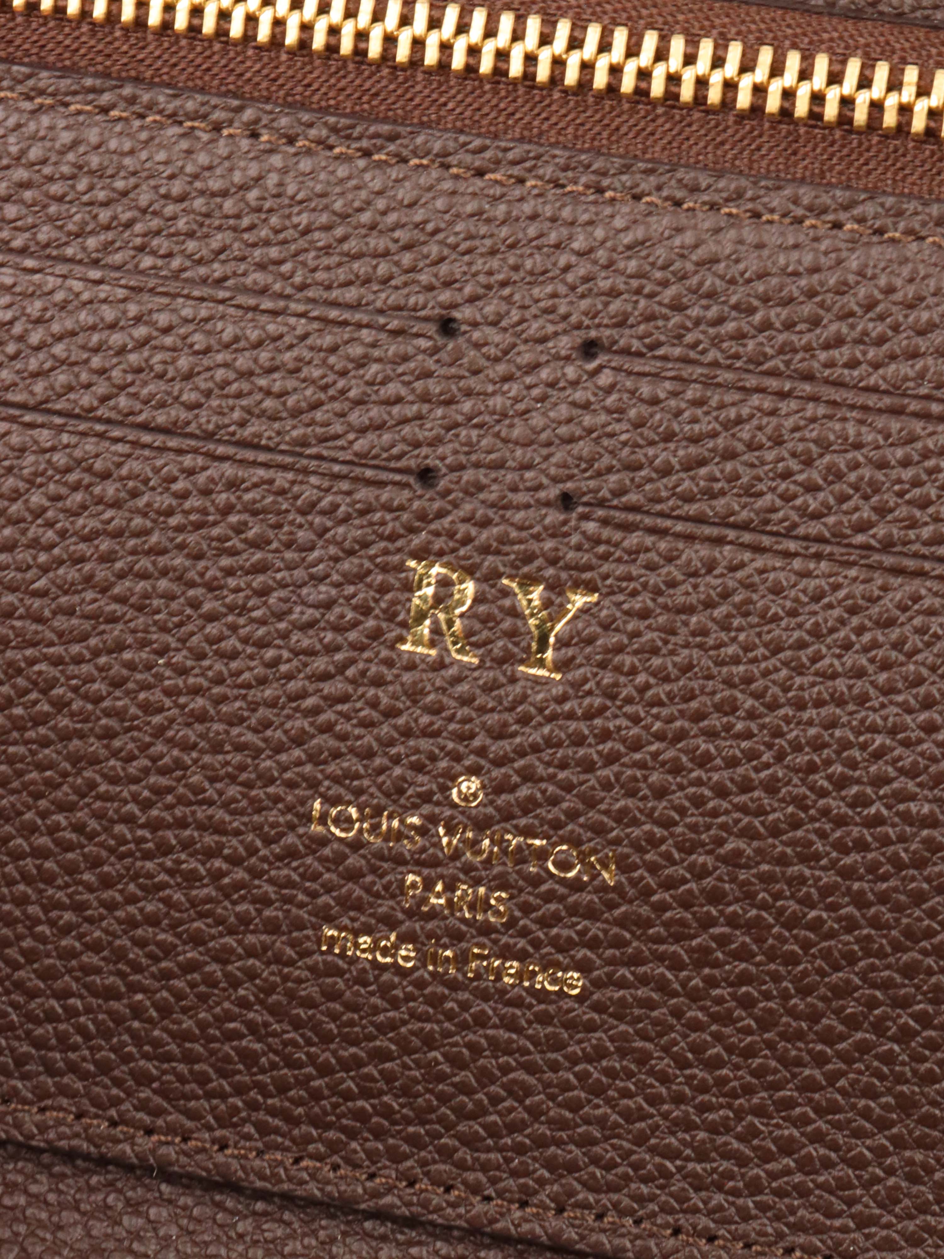 Louis Vuitton Dark Brown Zip Wallet.