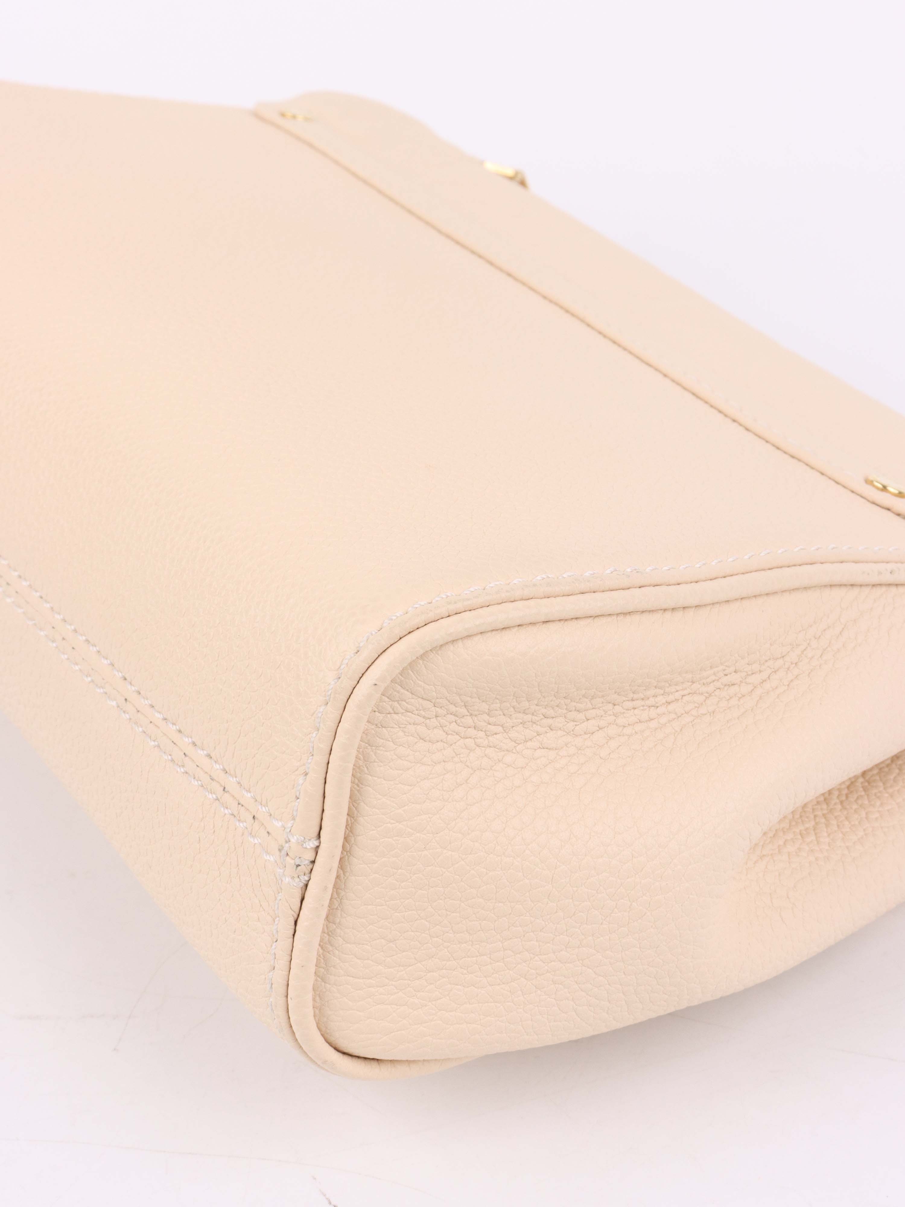 Louis Vuitton Cream Monogram Empreinte Saint Germain PM Bag.