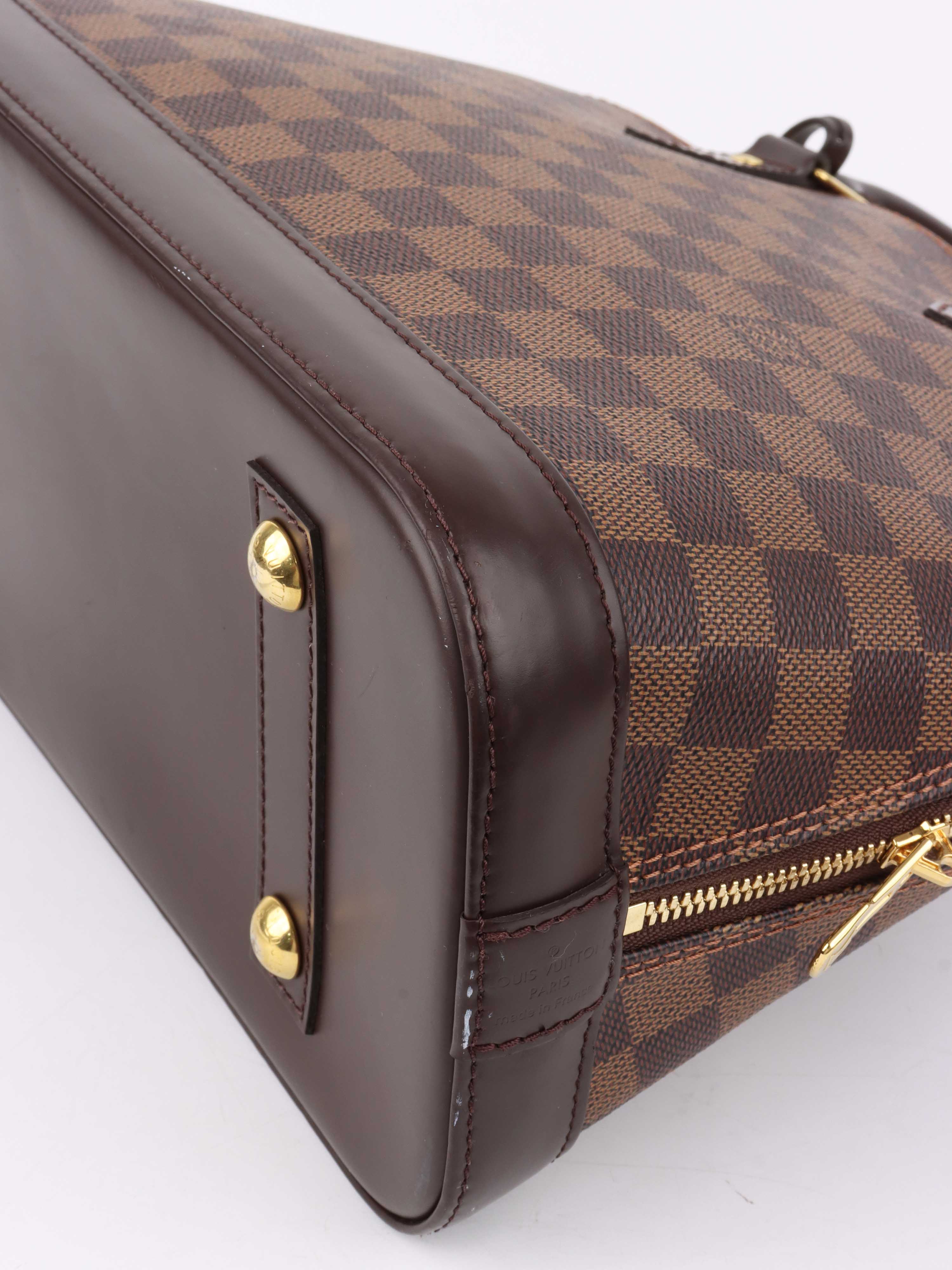 Louis Vuitton Damier Ebene Alma PM.