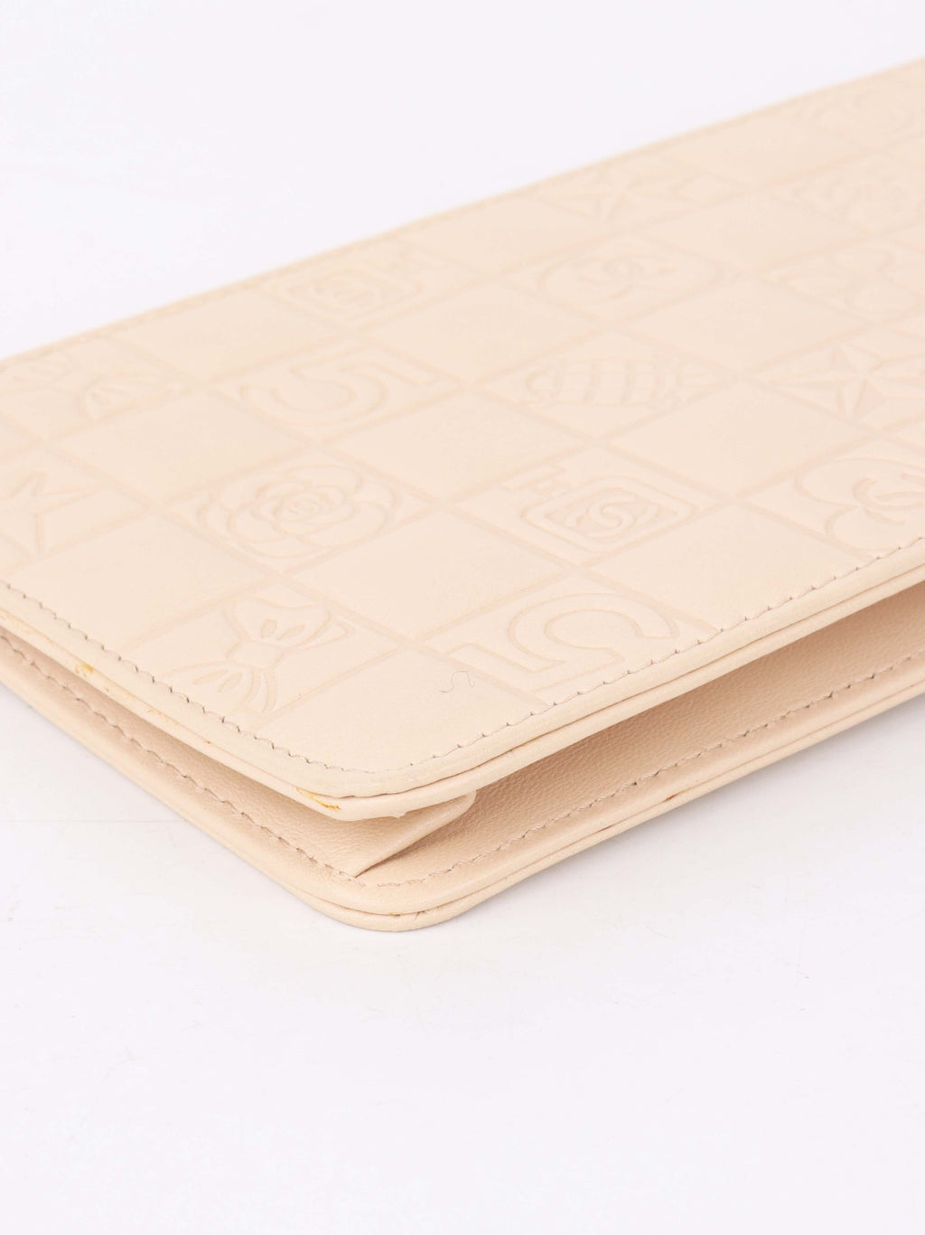 Chanel Beige Lucky Embossed Symbols Pochette with Wristlet Chain.