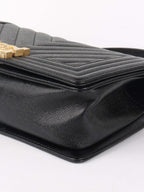 Chanel Black Chevron Caviar Medium Boy Bag.