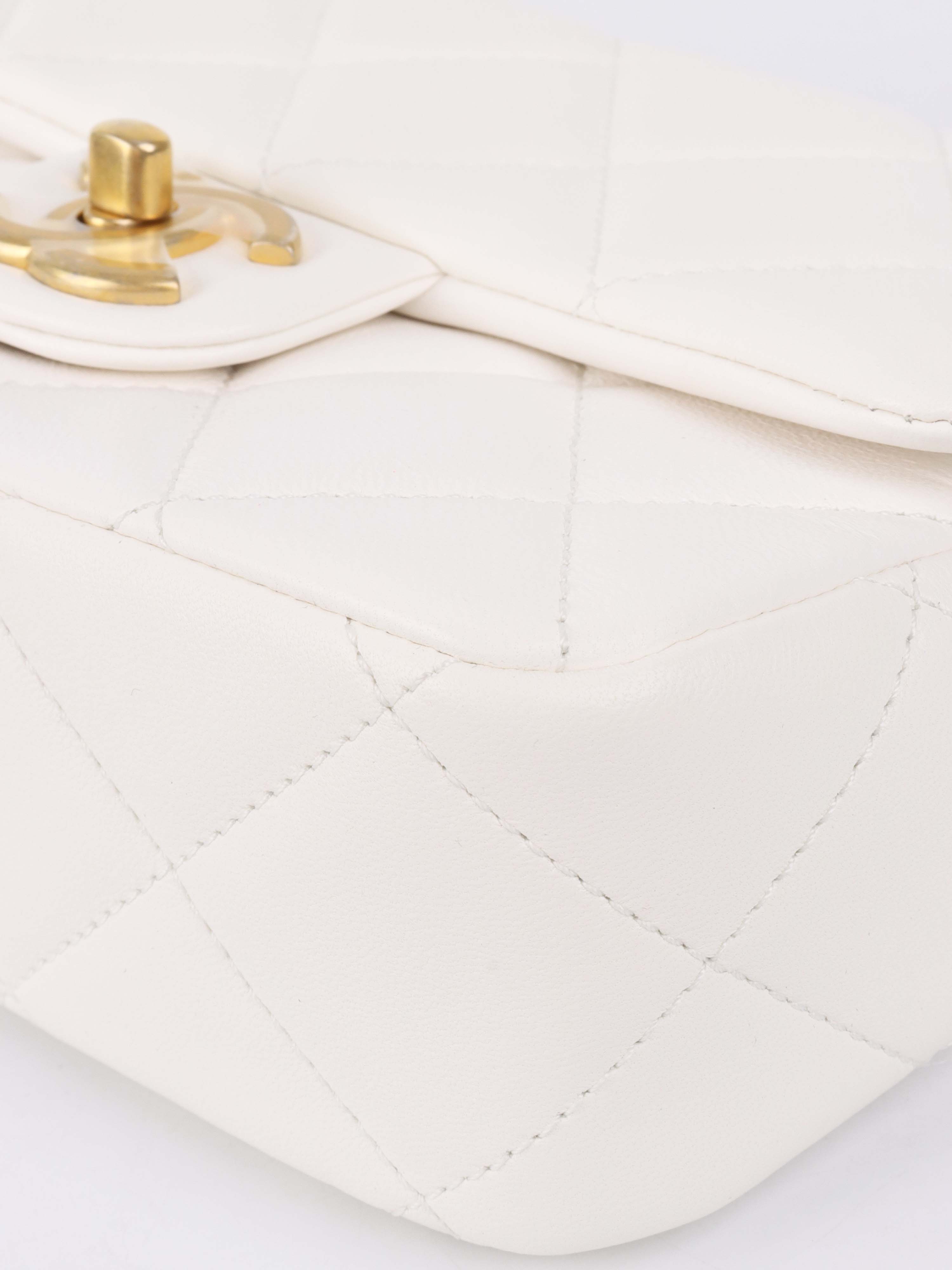 Chanel White and Pearl Chain Flap Bag.